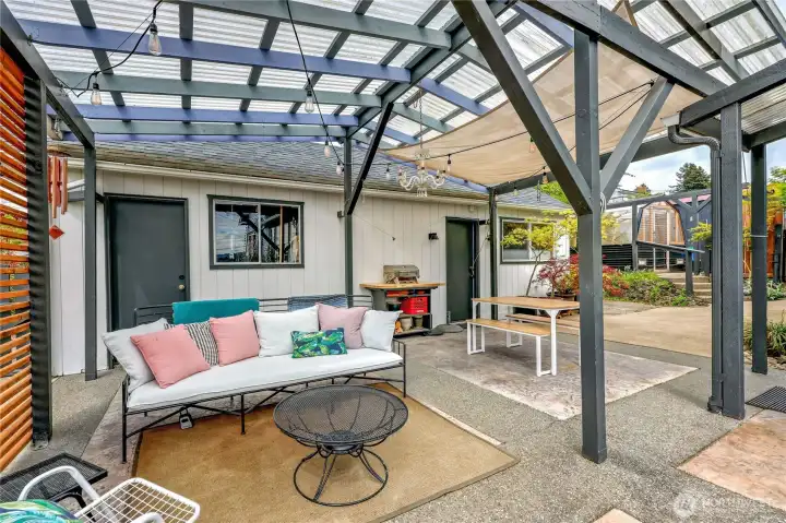 A lovely outdoor area to entertain even on those rainy days. Behind the door on the right you will find the office area which is attached to the garage.