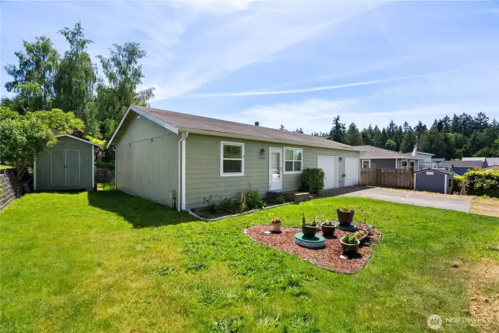 Nice and level yard- perfect for gardening and enjoyment Nice and level yard- perfect for gardening and enjoyment