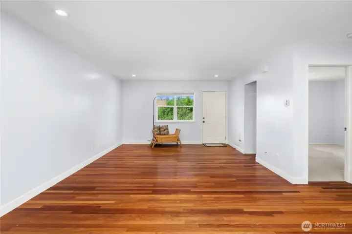 Gorgeous colored hardwood floors over this spacious living room- your entry is the top right Gorgeous colored hardwood floors over this spacious living room- your entry is the top right
