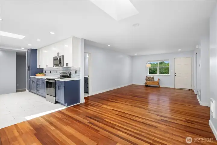 Hardwood floor transitions to radiant heated ceramic tile in the kitchen Hardwood floor transitions to radiant heated ceramic tile in the kitchen
