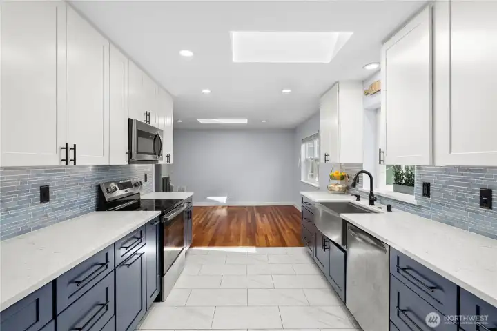 One year old kitchen- all new blue cabinetry, solid surface countertops, glass tile backsplashes, heated flooring and more One year old kitchen- all new blue cabinetry, solid surface countertops, glass tile backsplashes, heated flooring and more