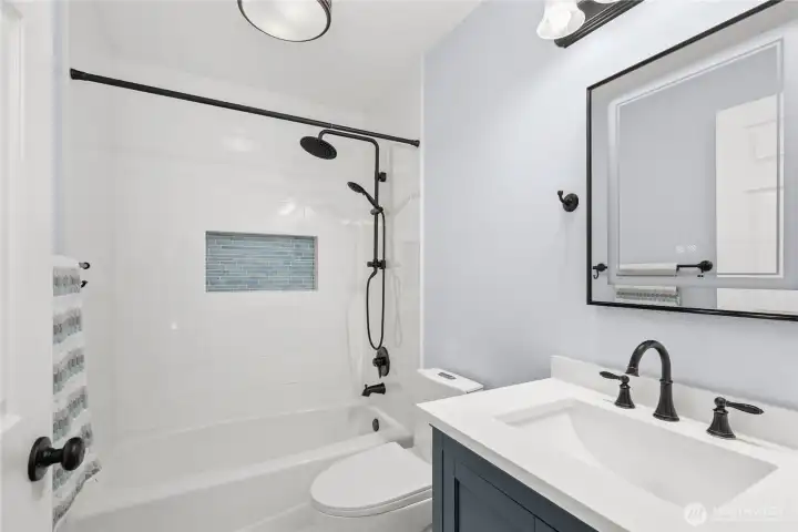 Brand new bathroom- updated to today's preferences- radiant ceramic tile heated floors, large shower niche and light up mirror Brand new bathroom- updated to today's preferences- radiant ceramic tile heated floors, large shower niche and light up mirror