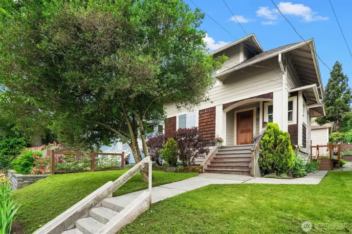 Front of home with nicely manicured yard.