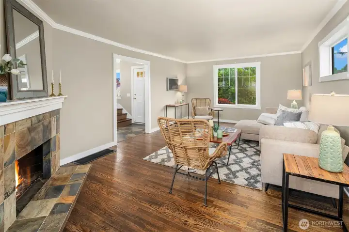 Living Room is a nice space to entertain. Enjoy the fireplace, molding and natural lighting.