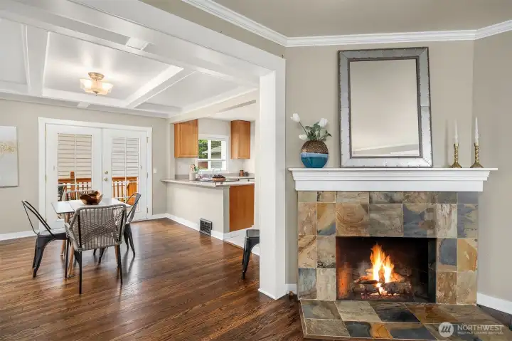 Fireplace, dining room and part of kitchen view.