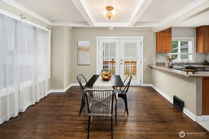 Dining Room and kitchen area. French doors lead to backyard.