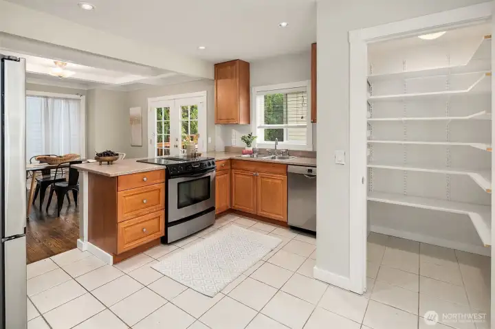 Kitchen with pantry which offers space for lots of storage.