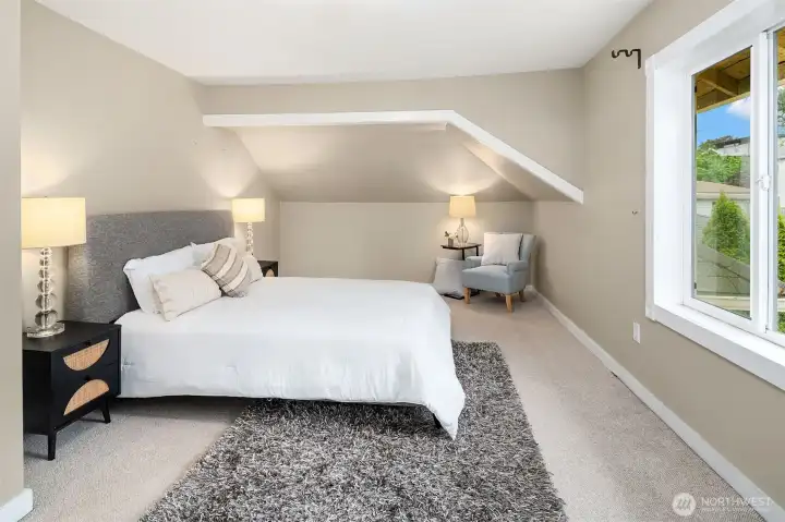 Primary Bedroom is spacious with white trim and baseboard.