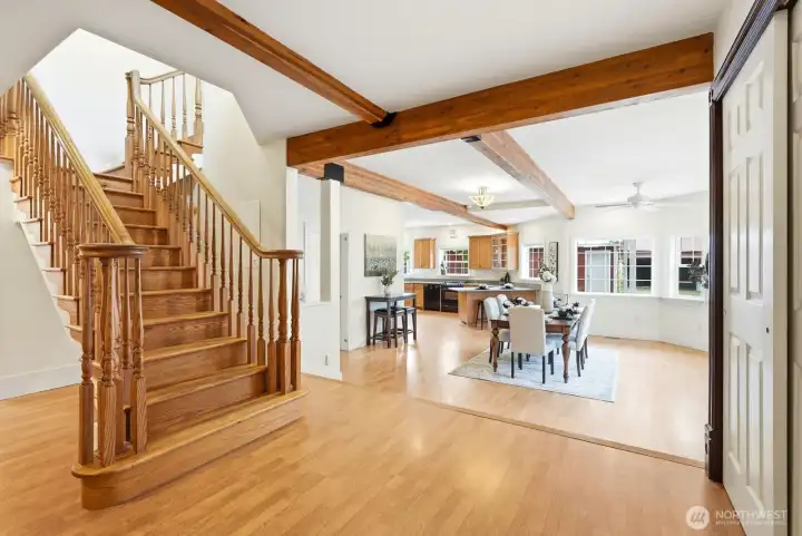 Grand staircase and open concept dining/kitchen Grand staircase and open concept dining/kitchen