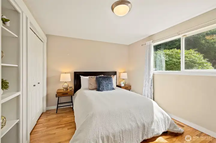Main Floor bedroom has original built ins that help keep this home so charming Main Floor bedroom has original built ins that help keep this home so charming