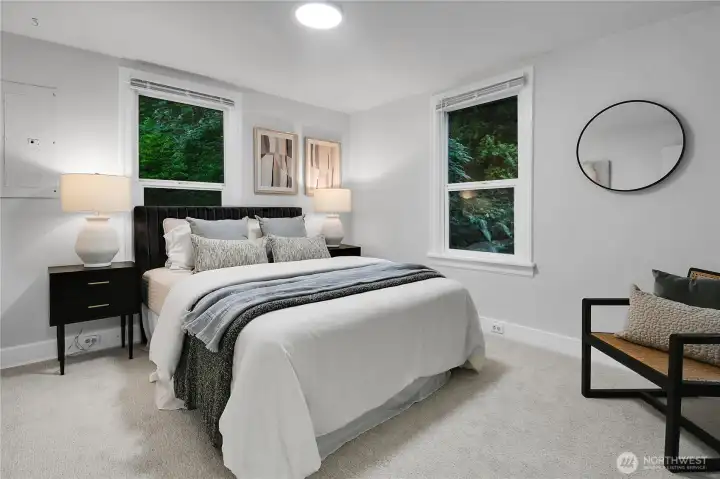 Comfortable main-floor bedroom with plush new carpet, ideal for guests, a home office, or convenient main-level living. Comfortable main-floor bedroom with plush new carpet, ideal for guests, a home office, or convenient main-level living.