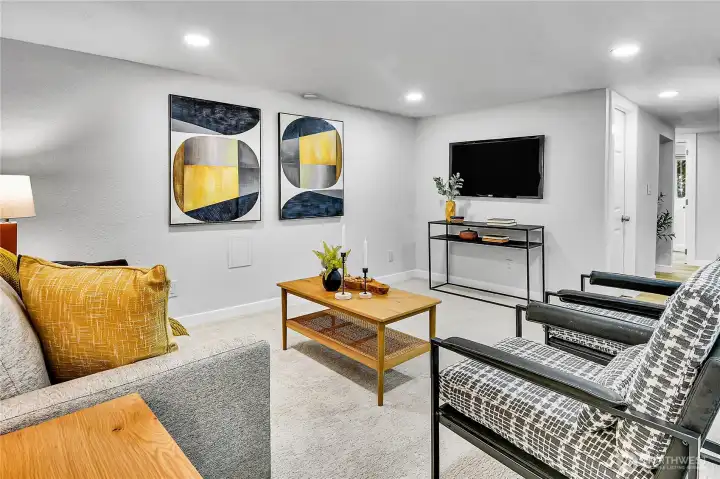 Beautifully renovated lower level offers a spacious family room with endless flexibility for movie nights, hobbies, fitness, or a work-from-home setup. Beautifully renovated lower level offers a spacious family room with endless flexibility for movie nights, hobbies, fitness, or a work-from-home setup.