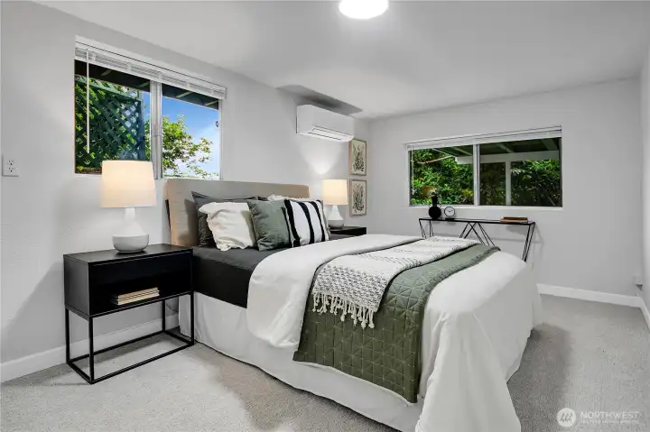Comfortable lower level bedroom with plush new carpet, ideal for guests or a private home office, featuring mini split for year round comfort. Comfortable lower level bedroom with plush new carpet, ideal for guests or a private home office, featuring mini split for year round comfort.