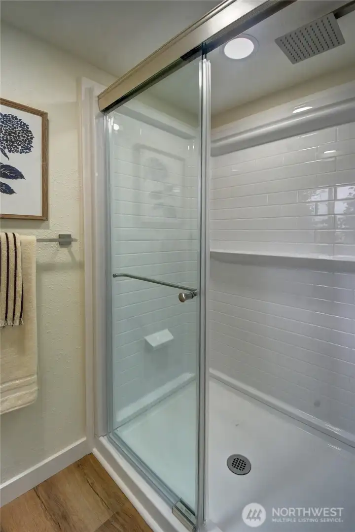 Brand-new ¾ bath featuring a stylish walk-in shower, contemporary finishes, and easy-care laminate flooring. Brand-new ¾ bath featuring a stylish walk-in shower, contemporary finishes, and easy-care laminate flooring.
