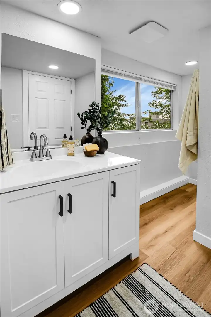 Brand-new ¾ bath featuring a stylish walk-in shower, contemporary finishes, and easy-care laminate flooring. Brand-new ¾ bath featuring a stylish walk-in shower, contemporary finishes, and easy-care laminate flooring.