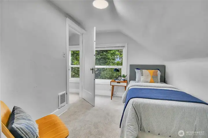 Cozy upper-level bedroom with new carpet and peaceful views, perfect for family, guests, or a home office. Cozy upper-level bedroom with new carpet and peaceful views, perfect for family, guests, or a home office.