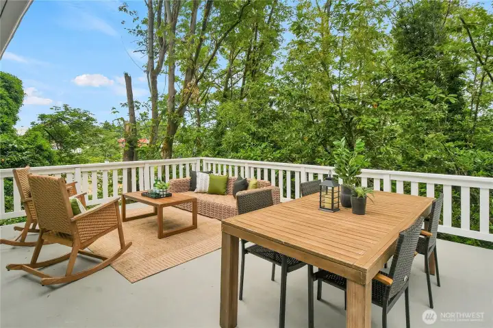 Expansive entertainment-sized deck overlooking the peaceful wooded setting, ideal for outdoor dining, relaxing, and summer BBQs. Expansive entertainment-sized deck overlooking the peaceful wooded setting, ideal for outdoor dining, relaxing, and summer BBQs.