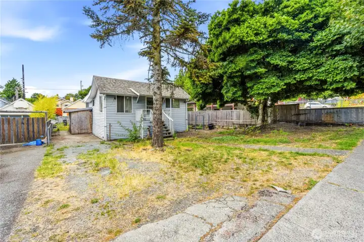 Home sits on a prime spacious flat lot zoned NR3 offering incredible build opportunity to restore home and/or build additional dwelling units for optimal use.