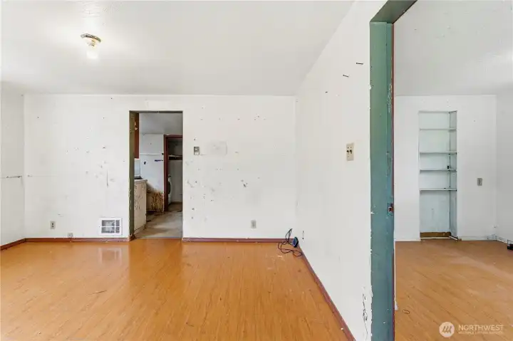From the entrance, the first bedroom is off to the right of the living room.