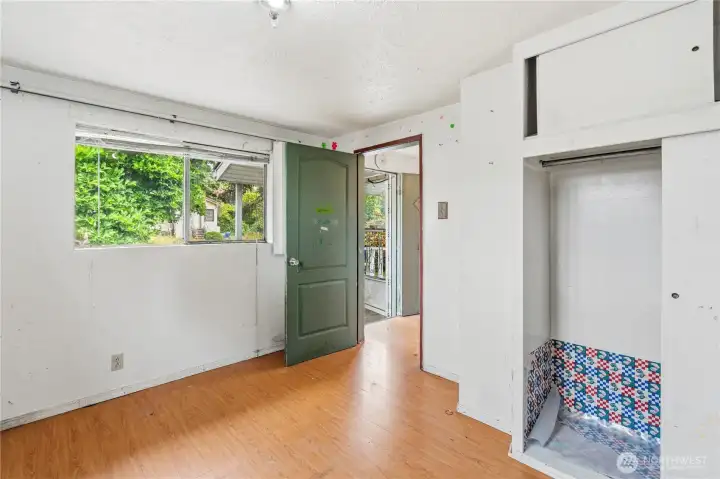 Another view of Bedroom #1 with windows overlooking the front yard.