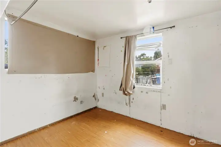 Past the utility room in the back of the house is Bedroom #2 overlooking the backyard.