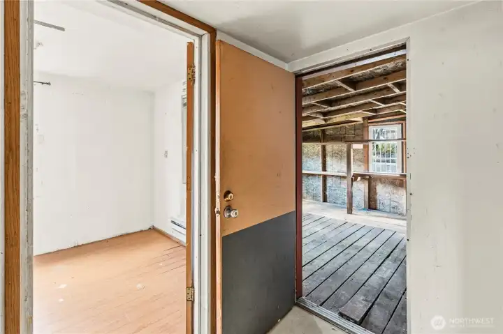 Past Bedroom #2 is a door to the back enclosed storage/flex space.