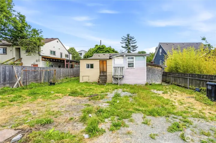 Home sits on a prime spacious flat lot zoned NR3 with the incredible opportunity to restore home and/or build additional dwelling units for optimal use.