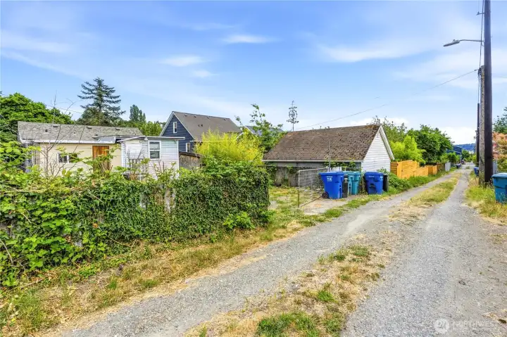 Convenient alley access with ample driveway & street parking.