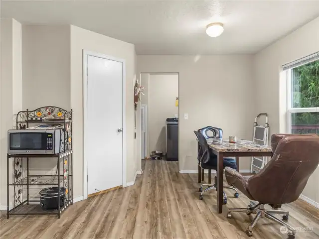 Your pantry lies behind white door on left. Laundry room is directly ahead with additional pantry storage to the left.