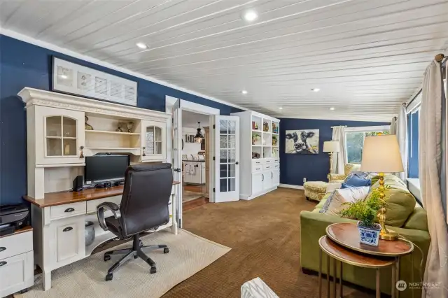 In the sunroom: this space is currently used as a very special office setting ... the shelves off to the right are built in.