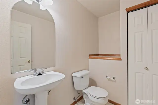 Just inside the front door and door between foyer and garage is the 1/2 bath.