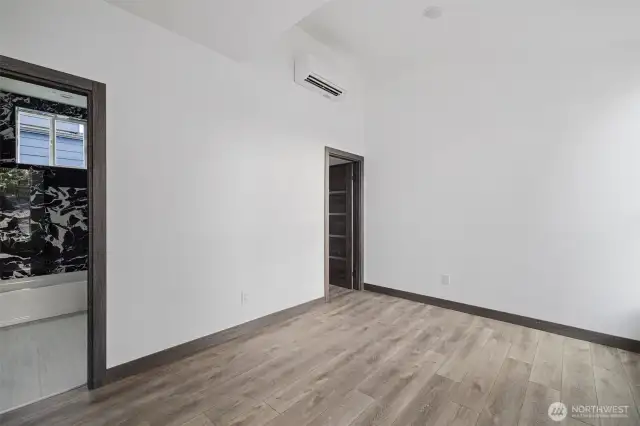 This Primary bedroom showcases the layout and high finishes you can expect in the newly constructed home at 8608 42nd Ave S, Seattle, WA 98118, built by the same builder.