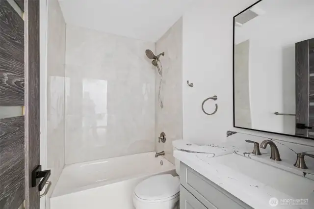 This full bath showcases the lay out and high finishes you can expect in the newly constructed home at 8608 42nd Ave S, Seattle, WA 98118, built by the same builder.