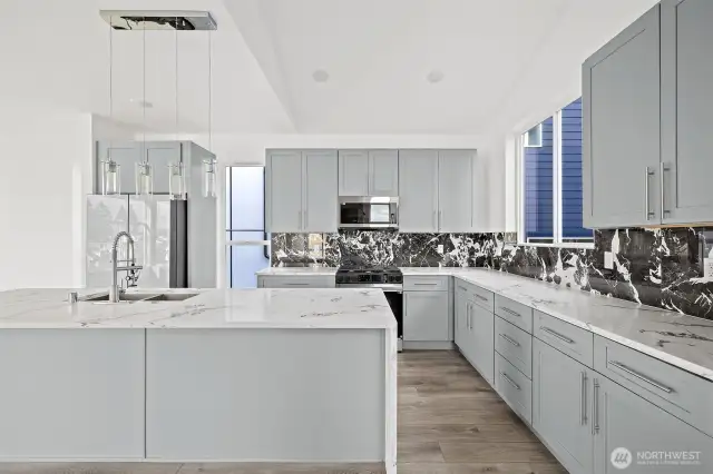 This kitchen showcases the lay out and high finishes you can expect in the newly constructed home at 8608 42nd Ave S, Seattle, WA 98118, built by the same builder."
