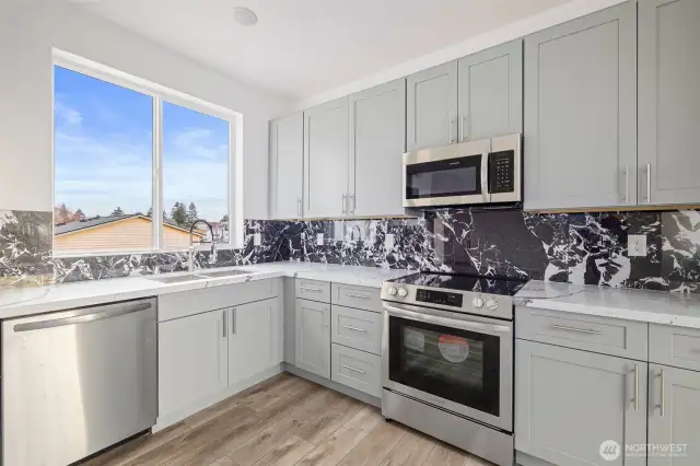 This kitchen showcases the lay out and high-quality finishes you can expect in the newly constructed residence at 8608 42nd Ave S, Seattle, WA 98118, built by the same builder.
