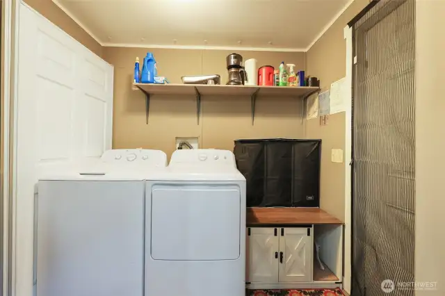 Laundry Room next to kitchen with back door