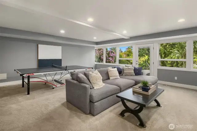 Downstairs, discover a generous bonus room that opens directly onto a large patio—ideal for indoor-outdoor living.