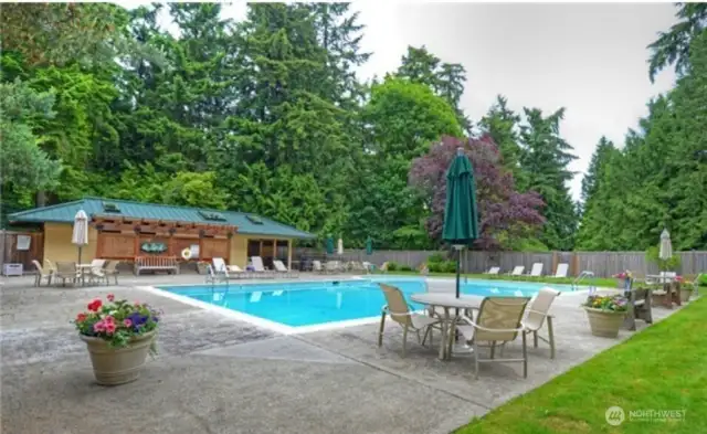 Community pool with tennis courts.