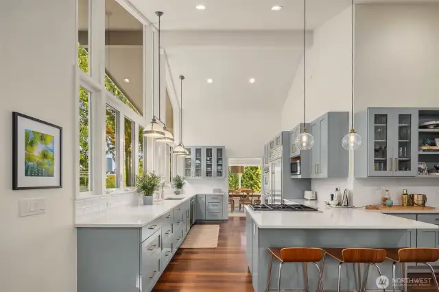 Entertain with ease in the stunning chef’s kitchen, featuring high-end appliances and elegant finishes.