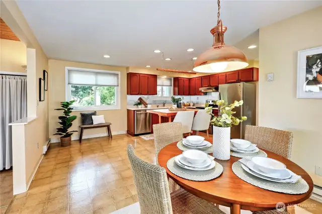A large dining table can go by the half wall or a 4 top fits nicely by the slider