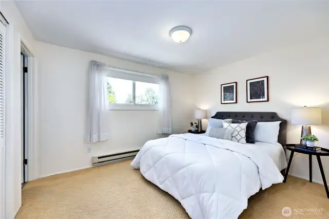 Primary bedroom with a window to the North