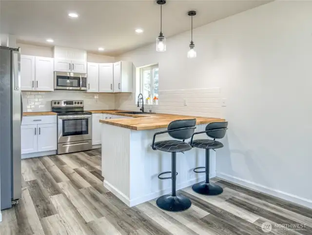 Butcher block counters and dining bar.