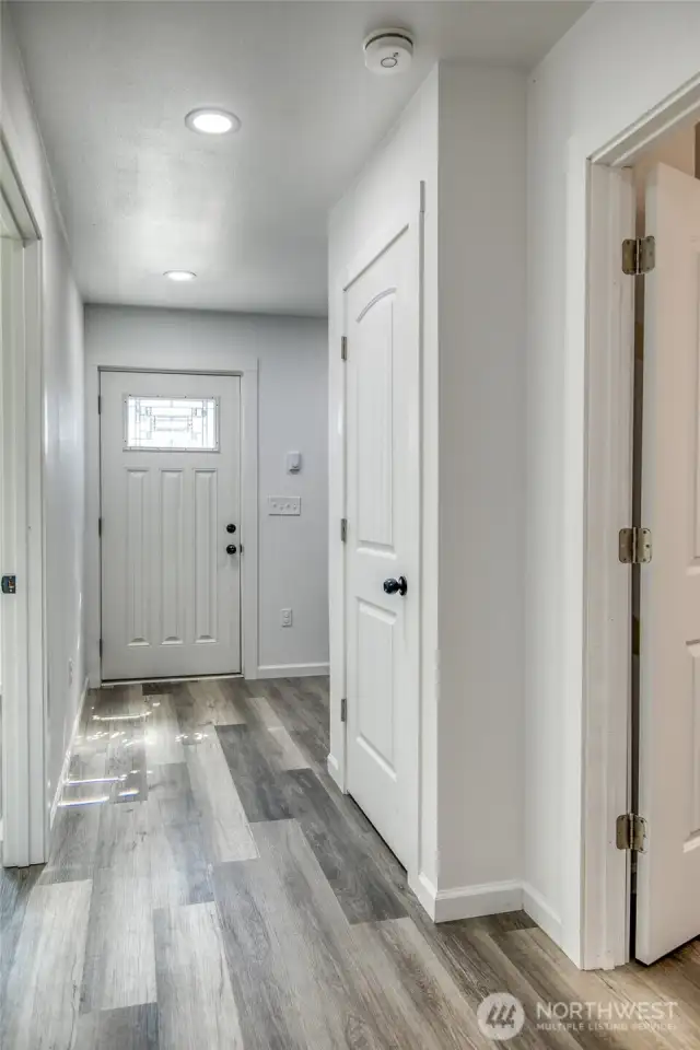 Hall leading to bedrooms, bathroom, and utility space.