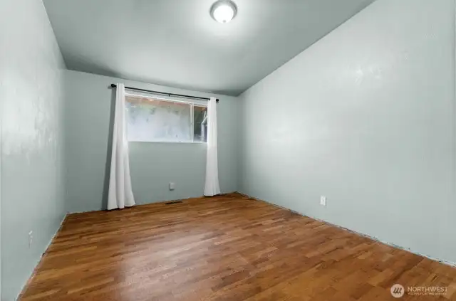 Bedroom #2 at the end of the hallway. Baseboard Trim was removed for carpet removal, and has since been re installed.