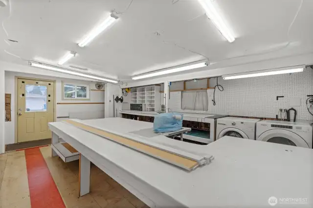 Large workshop/craft room, also serving as the laundry room.