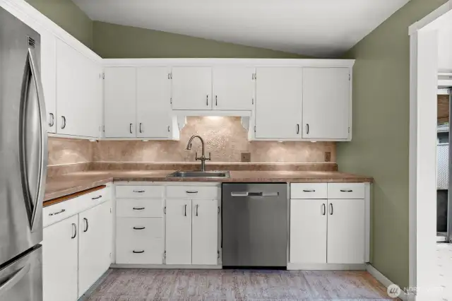 Under cabinet lighting helps this kitchen shine.