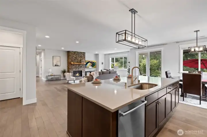 Open to living area, the gourmet kitchen is ideal for both entertaining guests and enjoying daily life.