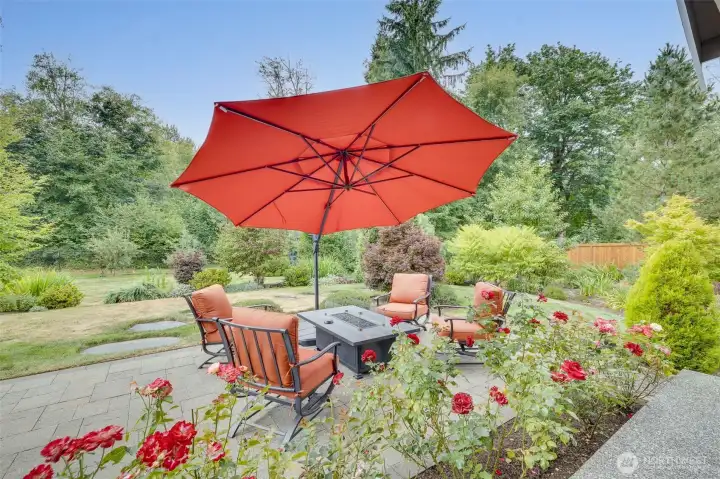 Covered and heated outdoor sitting area, plus adjacent fire pit table/seating offers a truly beautiful and tranquil, year-round retreat.