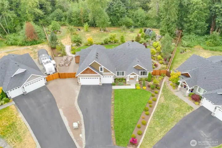 Set on a private, park-like acre, this beautiful custom rambler is surrounded by mature trees and protected greenbelt. Located in peaceful cul-de-sac, this home embodies luxury, privacy and Northwest charm.