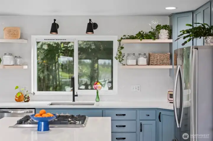 Calling all foodies! This updated modern gourmet kitchen is one to swoon over!
